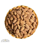 عکس مغز بادام درختی زرین خام تازه، دانههای درشت کرمی با پوست نازک و بافت ترد، بادام ایرانی اعلا با طعم شیرین طبیعی، بستهبندی ۵۰۰ گرمی غنی از پروتئین و ویتامین E برای میانوعده و آشپزی سالم.