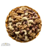 عکس دوم آجیل پنج مغز خام، نمای نزدیک ترکیب بادام، پسته، فندق، تخمه و نخودچی باکیفیت، آجیل مخلوط ایرانی غنی از پروتئین، فیبر و ویتامینها، بستهبندی ۵۰۰ گرمی برای میانوعده و رژیمهای سالم
