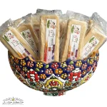 عکس قره قروت استیکی سفید سنتی ترش و خوش طعم، بسته‌بندی بهداشتی استیکی با بافت نرم و رنگ سفید طبیعی، محصول لبنی ایرانی غنی از پروتئین و پروبیوتیک‌ها، مناسب آشپزی و میان‌وعده سالم.